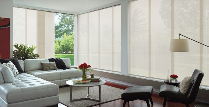 White Panel Glide venetian style blinds over large windows