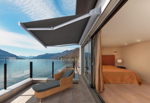 Dark fabric Folding Arm Awning on balcony