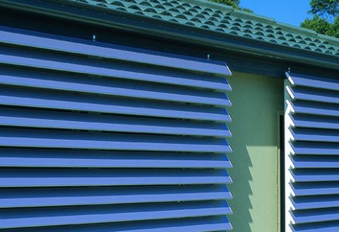Outdoor Shutters in Blue on side of house